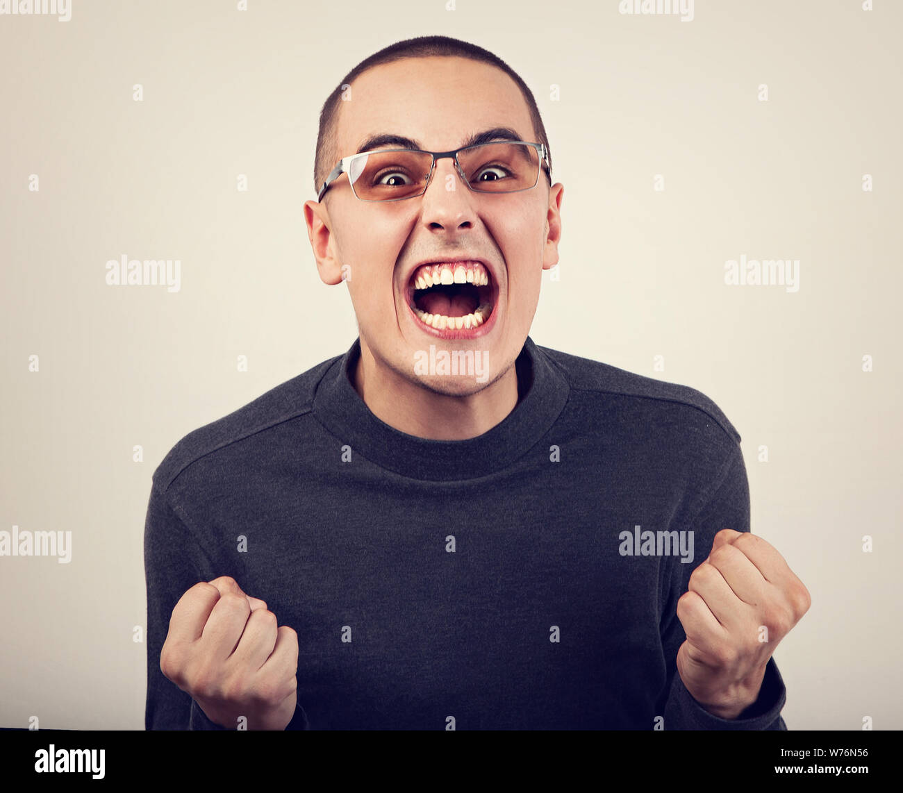 Angry Young Man Shouting With Open Mouth And Very Anger Face Showing