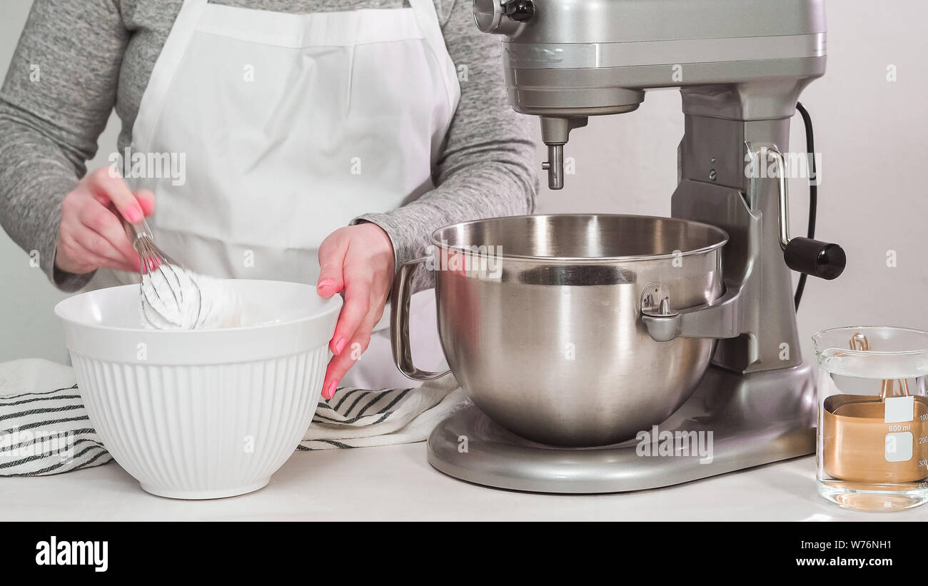 Step by step. Flat lay. Mixing royal icing in electric kitchen mixer