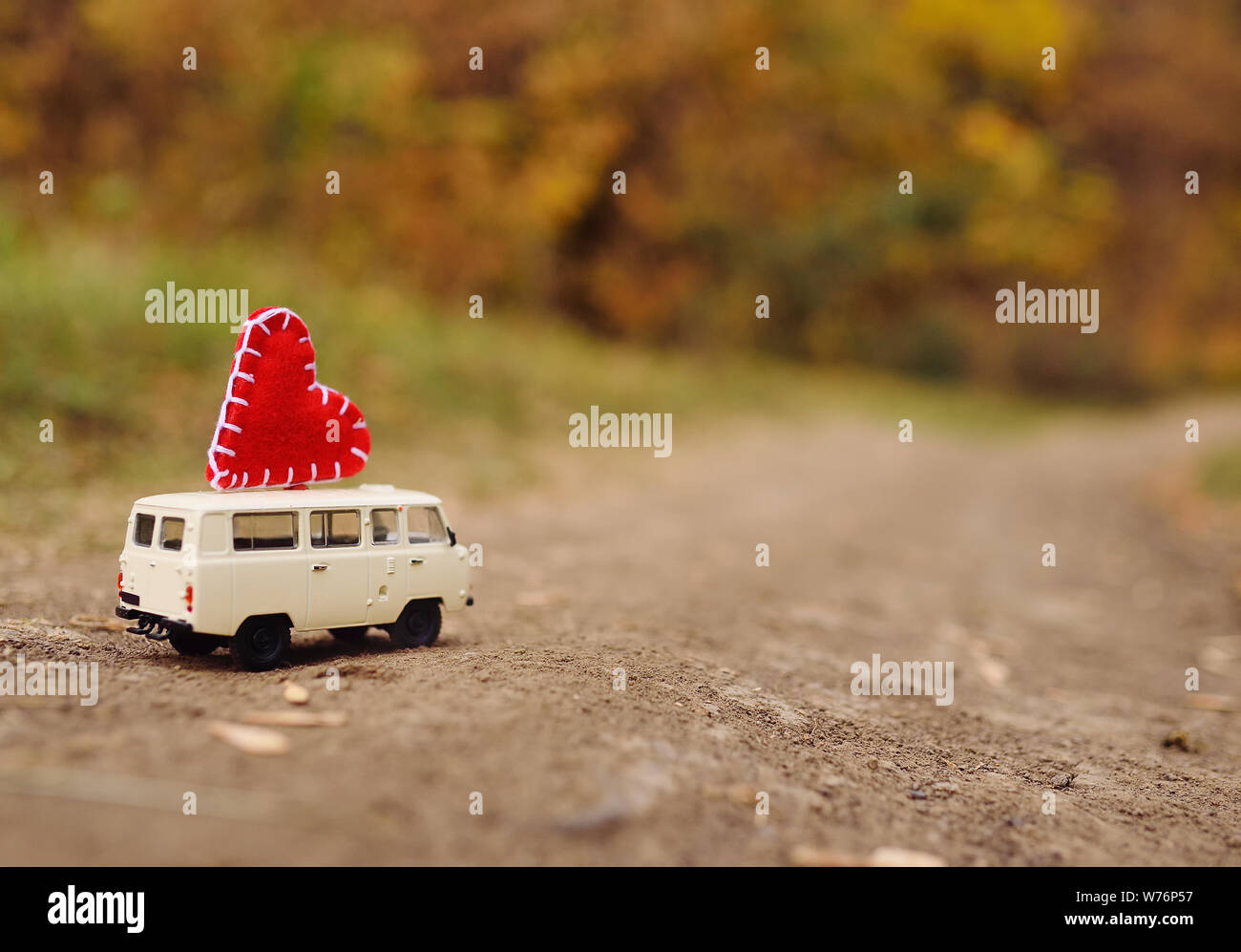 red toy car with yellow roof