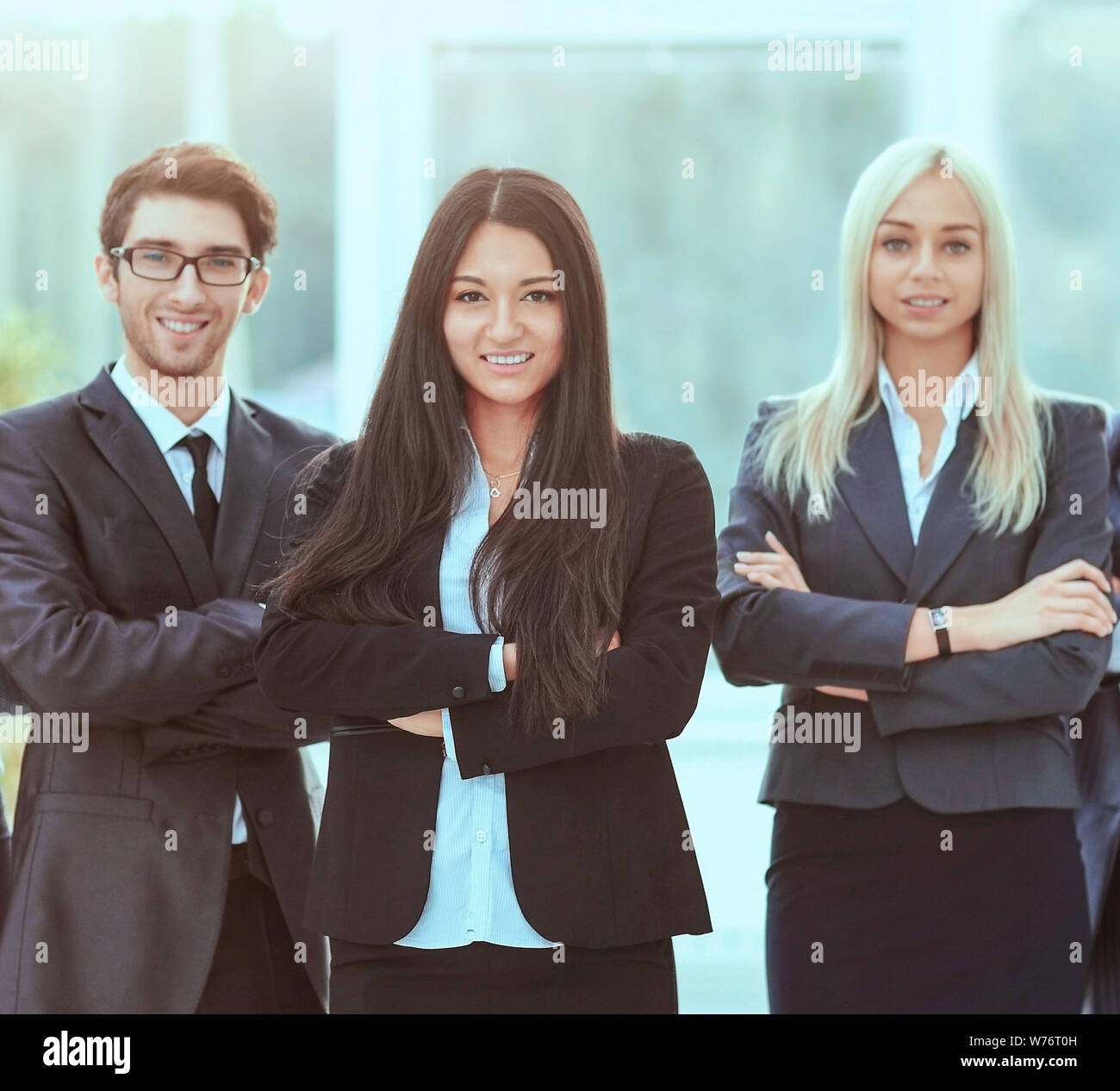 Group portrait of a professional business team looking confidently at camera Stock Photo
