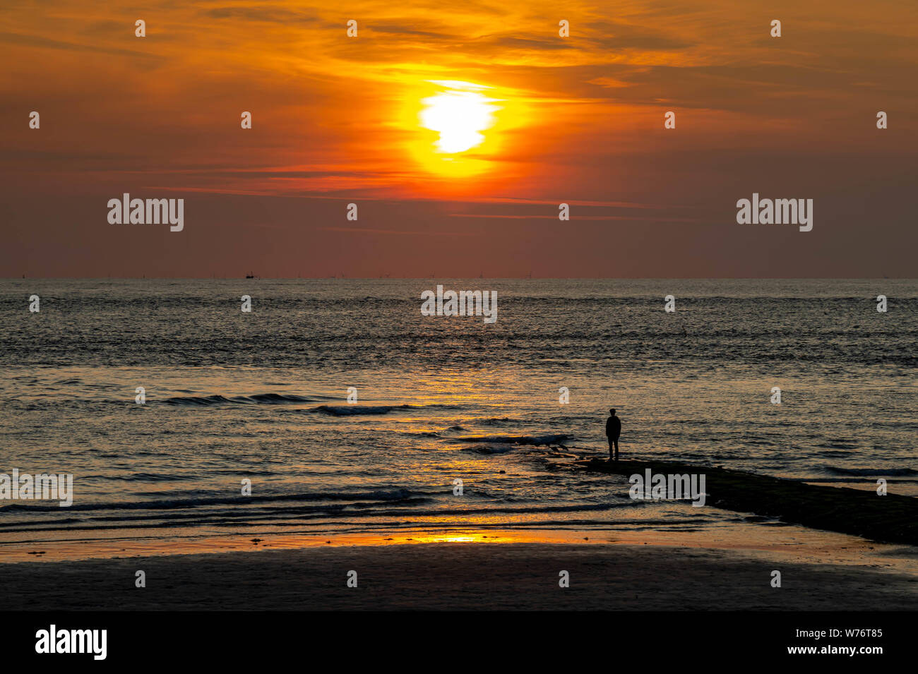 regain power relaxing in sunset, travel norderney Germany Stock Photo
