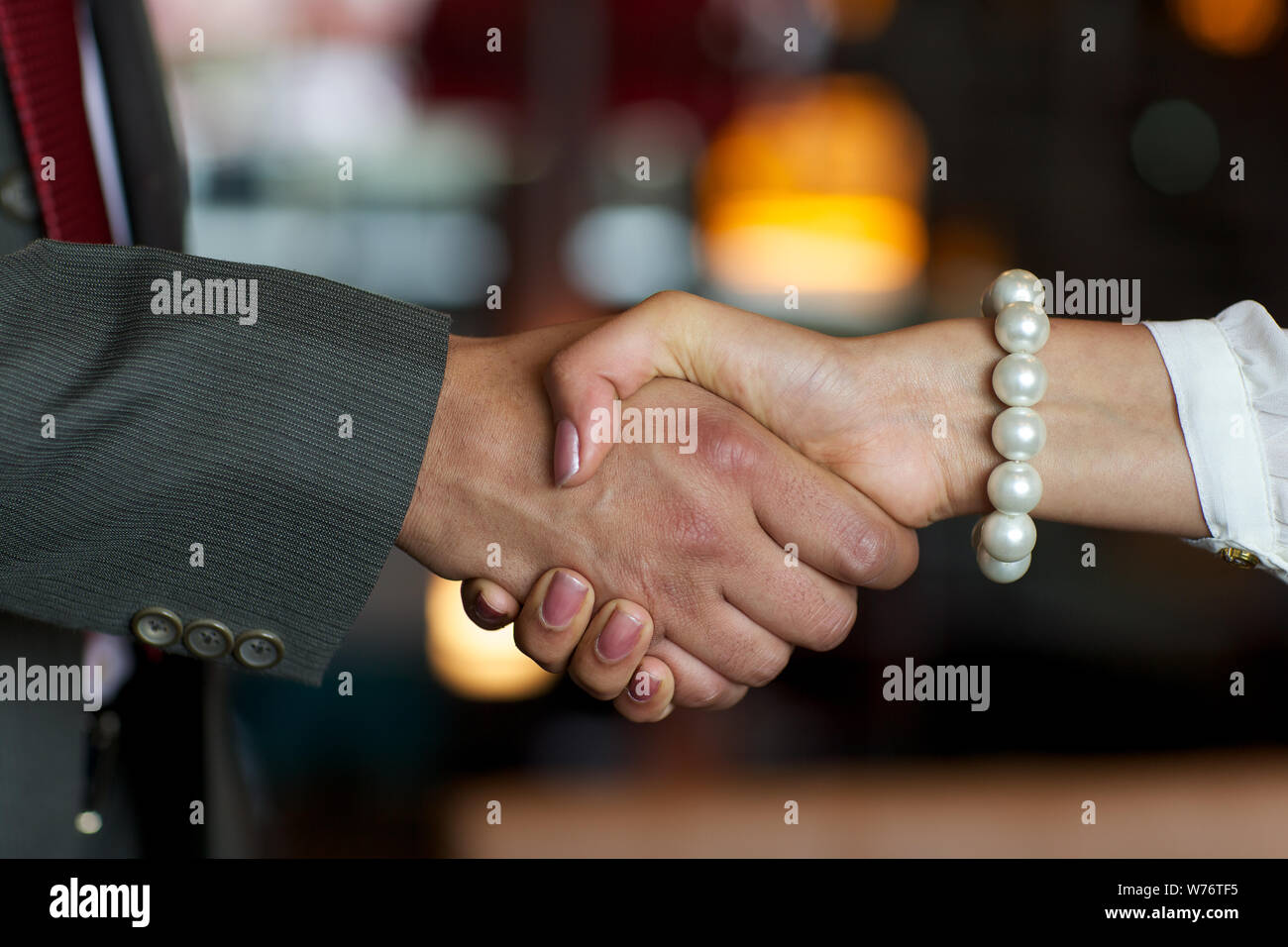 Close up of two business executives shaking hands Stock Photo
