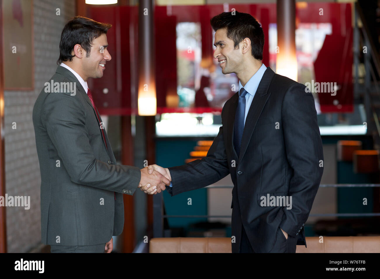 Two business executives shaking hands Stock Photo