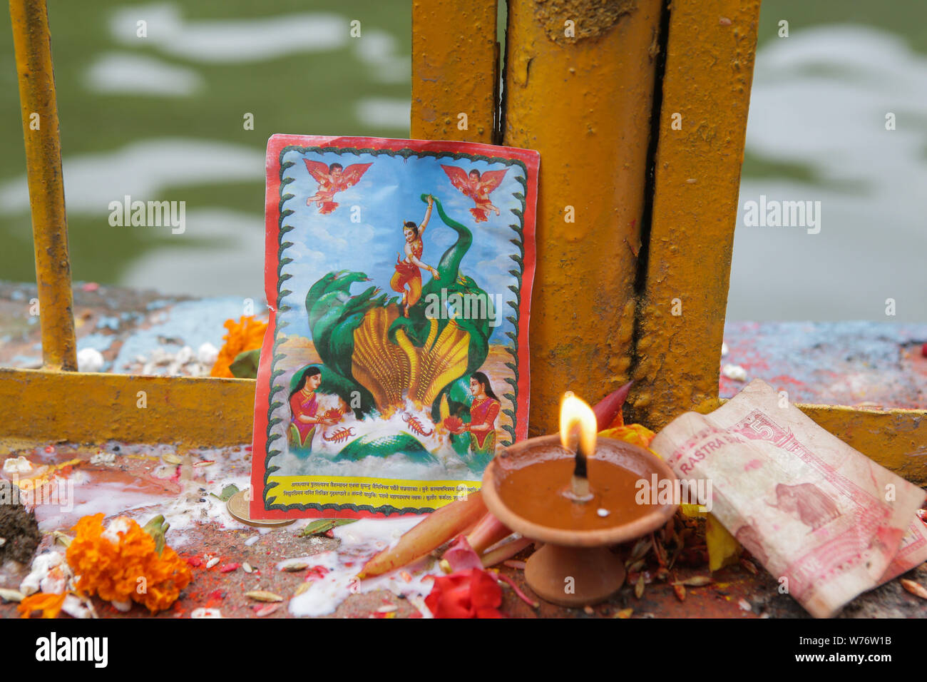 An image of snake god at the Nagpokhari during a Festival.Nag-Panchami is a festival to worship snakes or serpents, it’s observed by Hindus all over the world. The festival is observed during the monsoon with prayers and tributes to snakes. Stock Photo