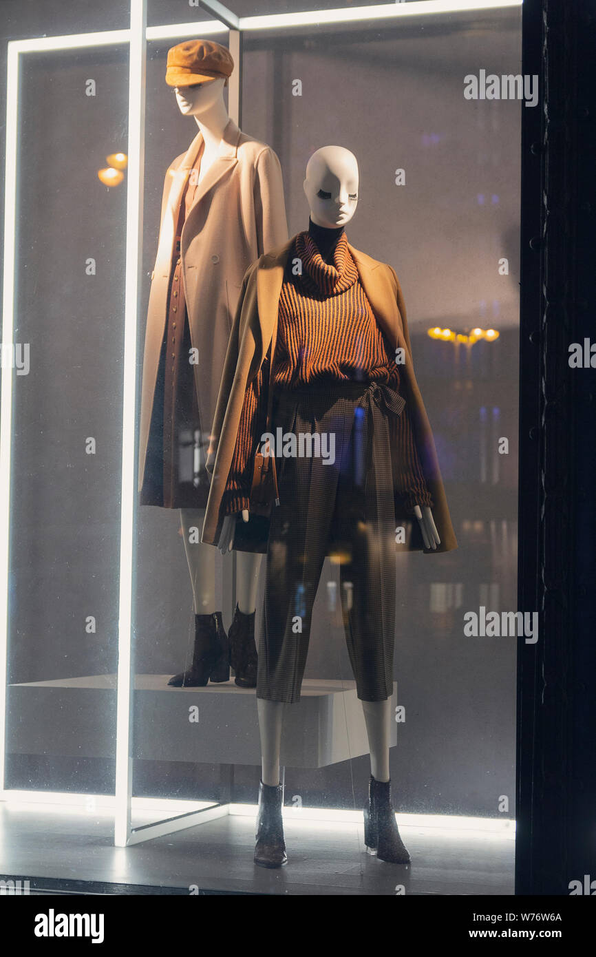Female mannequins in trendy clothes in the shop window Stock Photo Alamy