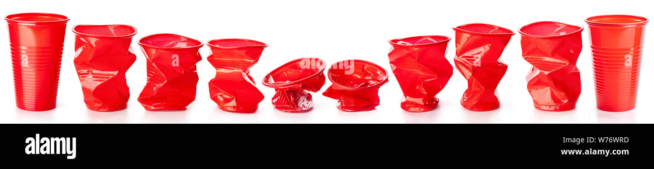Red crumpled plastic cups isolated on white background Stock Photo