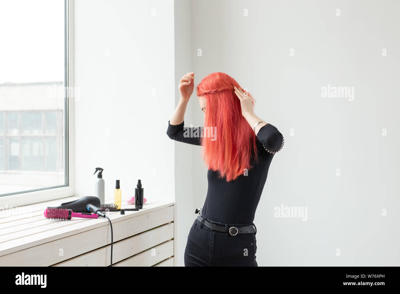 Beautiful Red Haired Girl With Long Hair She Is Weaves A Braid