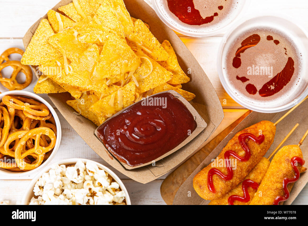 Selection of stadium game foods nachos, pop corn, pretzels, corn dogs