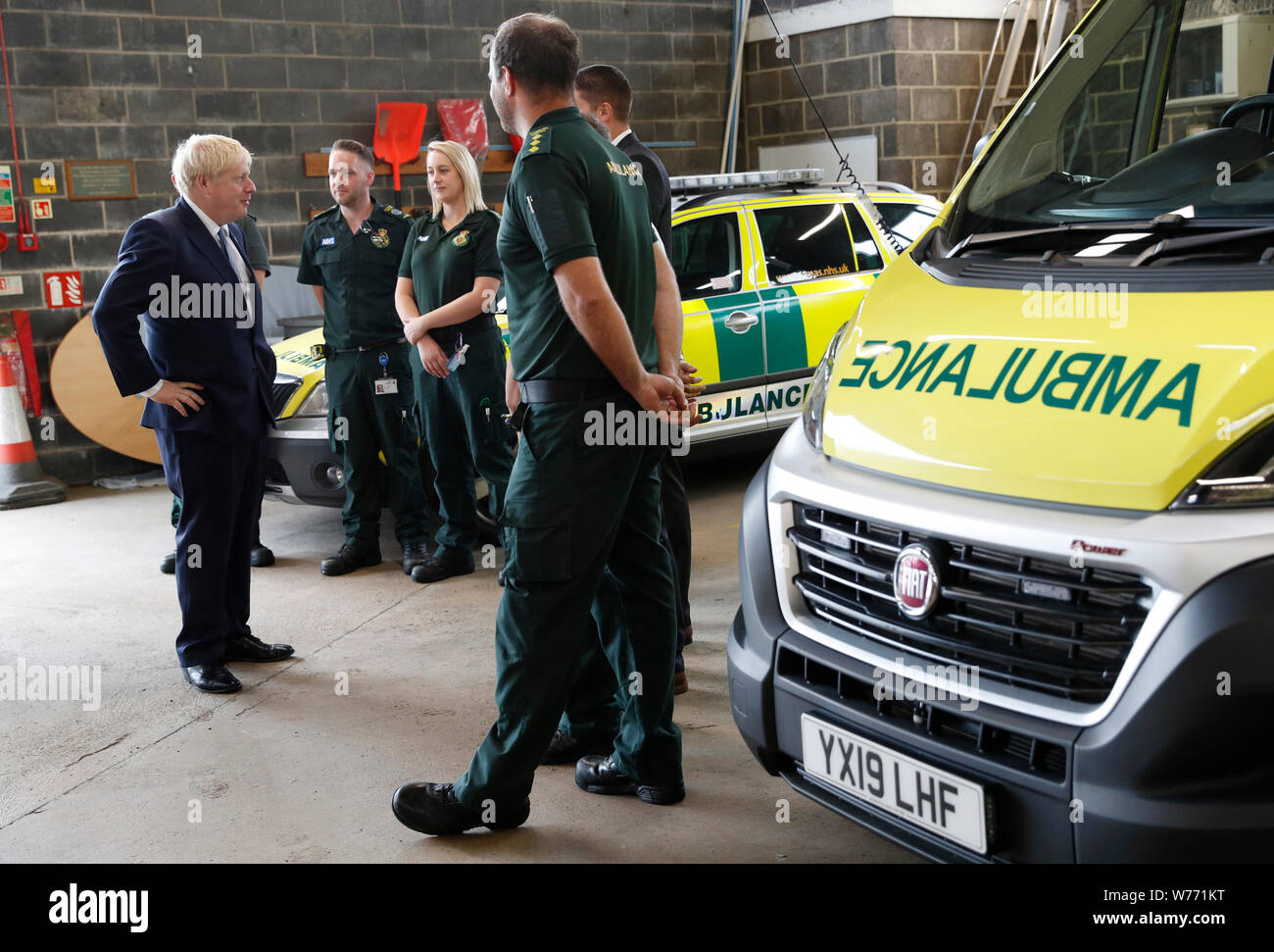 Prime Minister Boris Johnson chats with Ambulance crews during a visit to Pilgrim Hospital in Boston, Lincolnshire, to announce the government's NHS spending pledge of 1.8 billion. Stock Photo