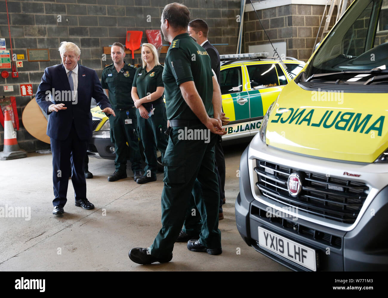 Prime Minister Boris Johnson chats with Ambulance crews during a visit to Pilgrim Hospital in Boston, Lincolnshire, to announce the government's NHS spending pledge of 1.8 billion. Stock Photo