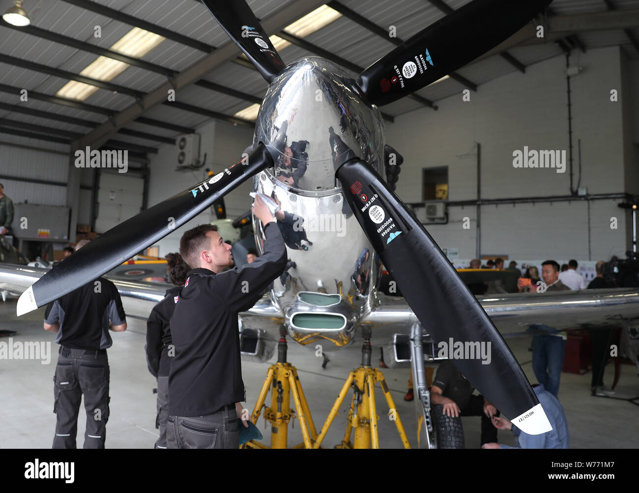 IWC Silver Spitfire pilots Matt Jones and Steve Boultbee Brooks with their newly restored MK IX Spitfire at Goodwood Aerodrome. The pair are attempting to fly the MK IX Spitfire named Silver