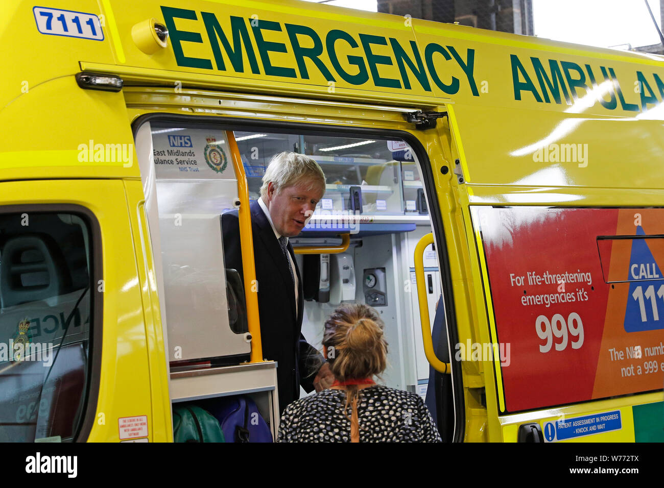 Prime Minister Boris Johnson inspects an ambulance during a visit to Pilgrim Hospital in Boston, Lincolnshire, to announce the government's NHS spending pledge of 1.8 billion. Stock Photo