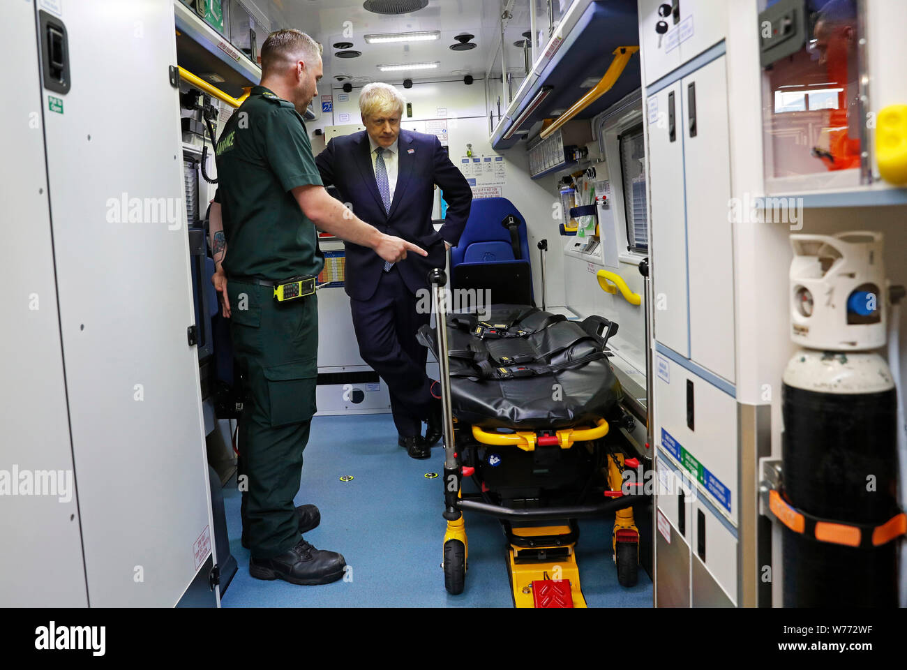 Prime Minister Boris Johnson inspects an ambulance during a visit to Pilgrim Hospital in Boston, Lincolnshire, to announce the government's NHS spending pledge of 1.8 billion. Stock Photo