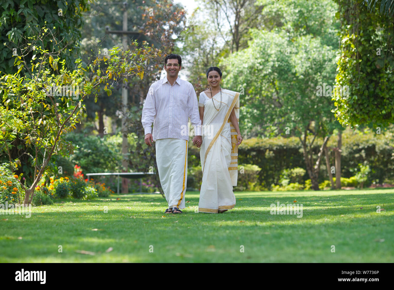 South Indian couple walking in a park Stock Photo - Alamy