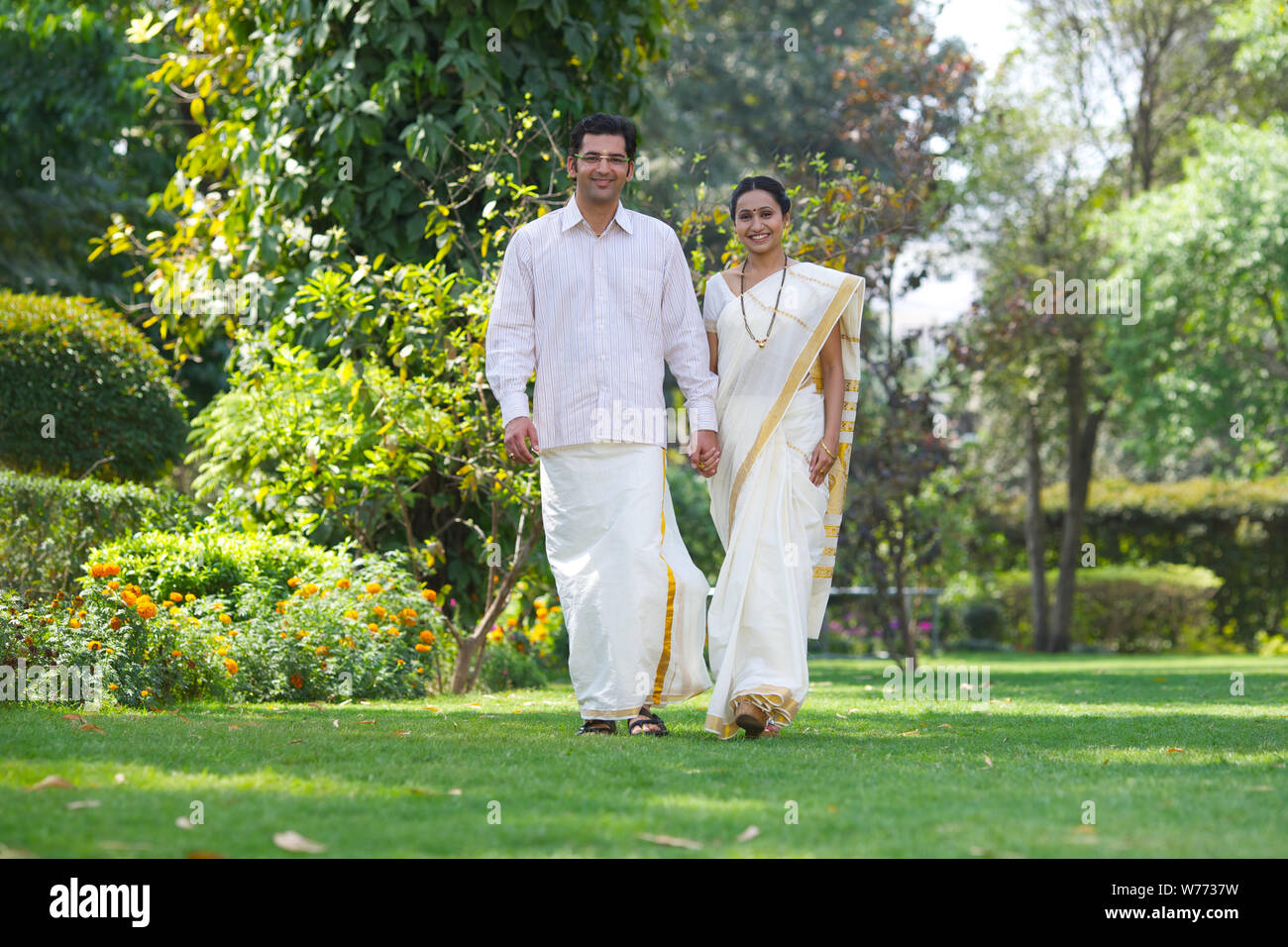 South Indian couple walking in a park Stock Photo - Alamy
