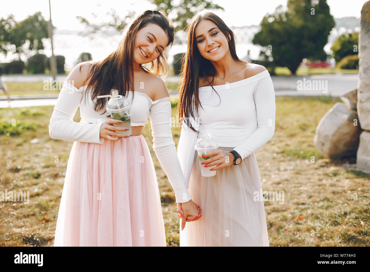 Two pretty girls in a summer park Stock Photo - Alamy