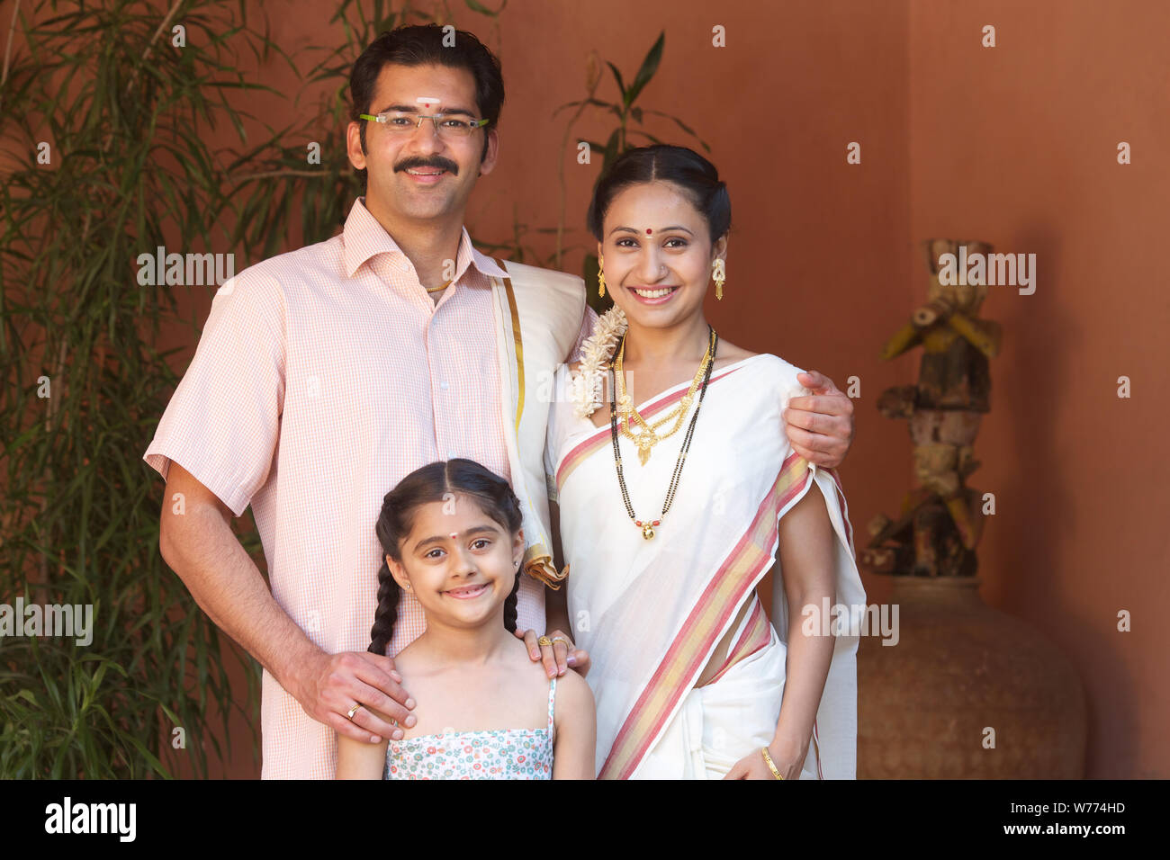 South Indian family standing together Stock Photo