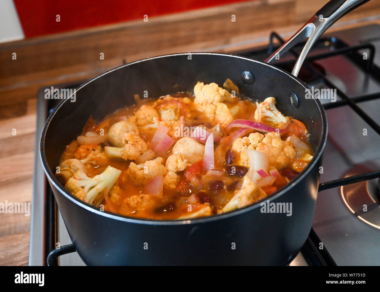Cooking vegetables A la grecque which is a French dish . The vegetables are slightly pickled in a vegetable stock and wine Stock Photo