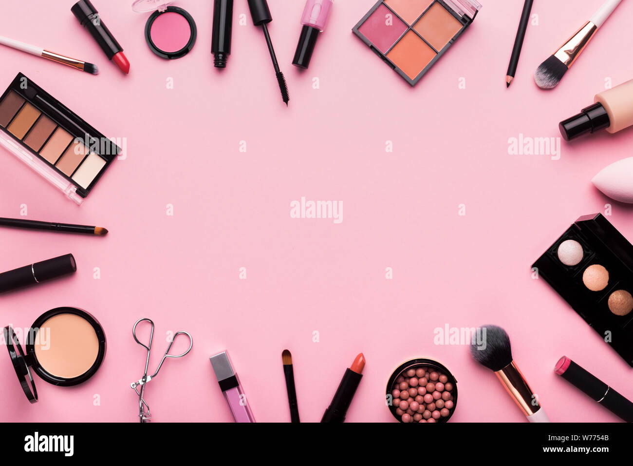 Frame of professional cosmetics and brushes around blank space Stock Photo