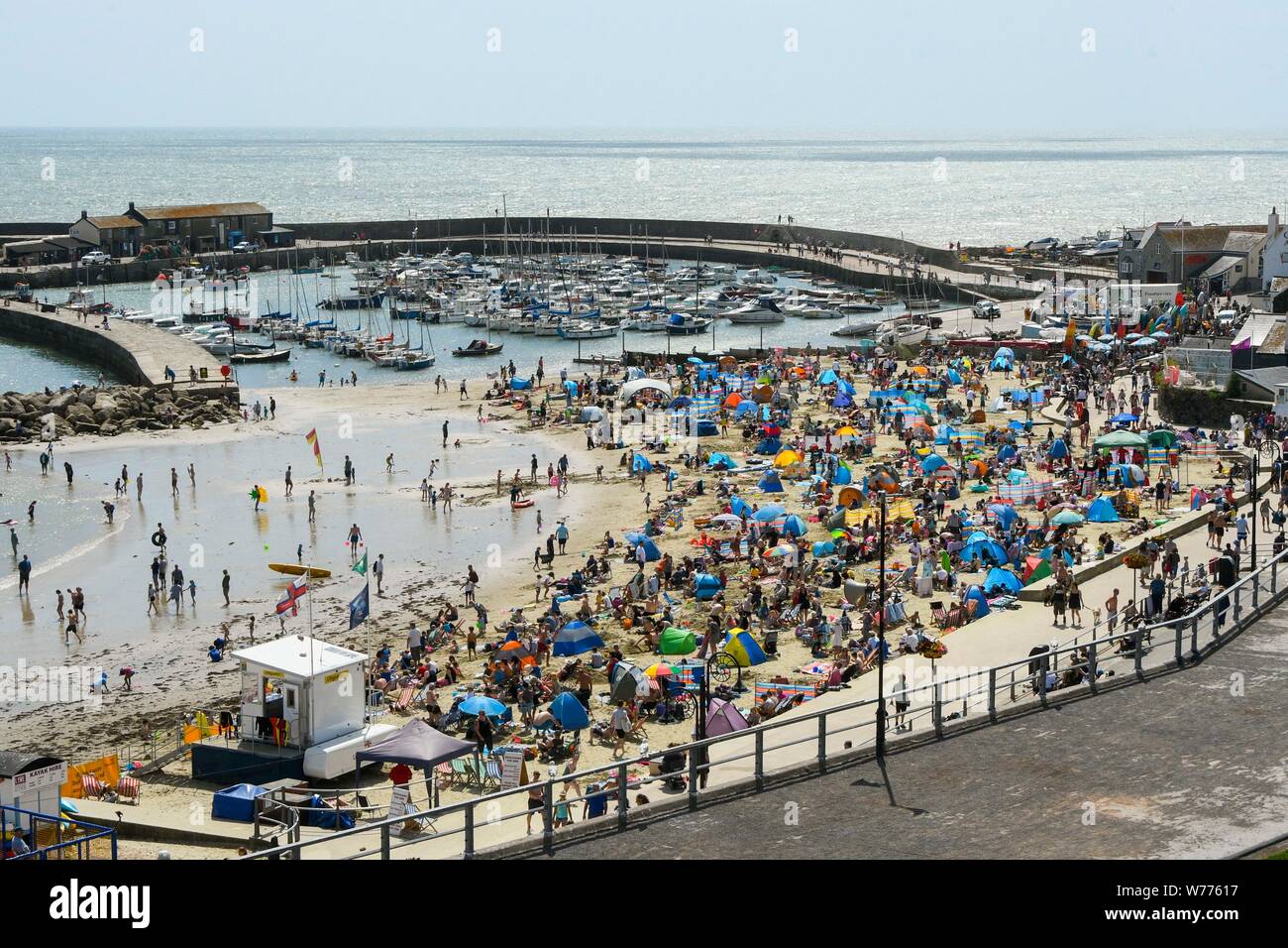 Lyme Regis, Dorset, UK.  5th August 2019. UK Weather.  Holidaymakers and sunbathers pack the beach at the seaside resort of Lyme Regis in Dorset on a hot sunny day.  Picture Credit: Graham Hunt/Alamy Live News Stock Photo
