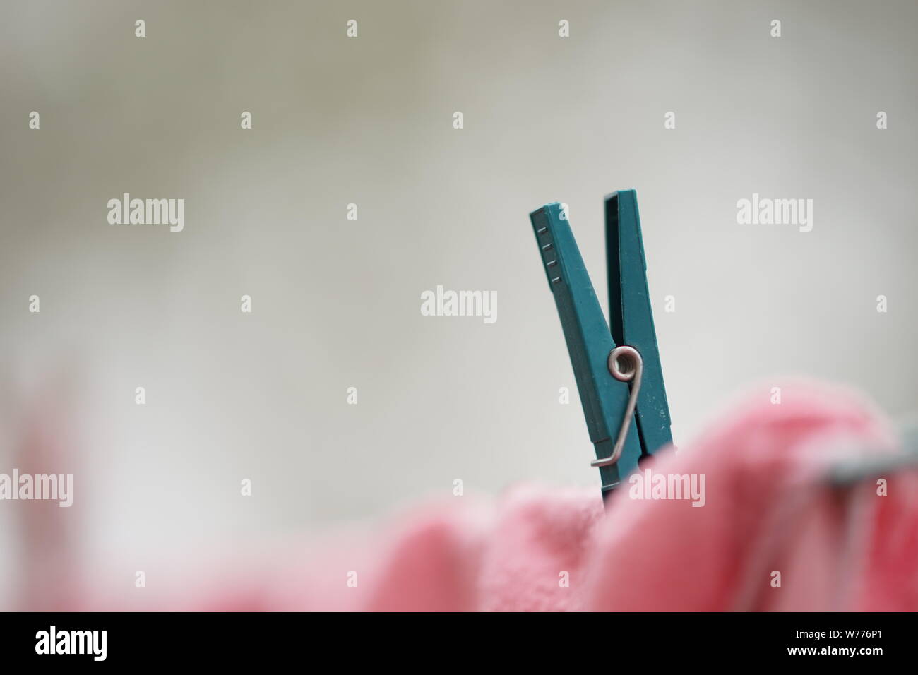Clothespin holds clothes on a rope, macro image, side view Stock Photo Alamy