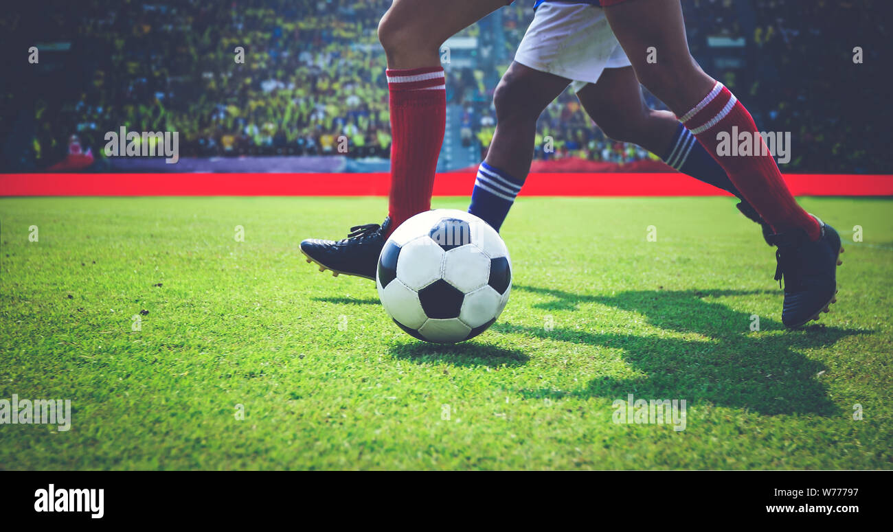 soccer or football player standing with ball on the field for Kick the
