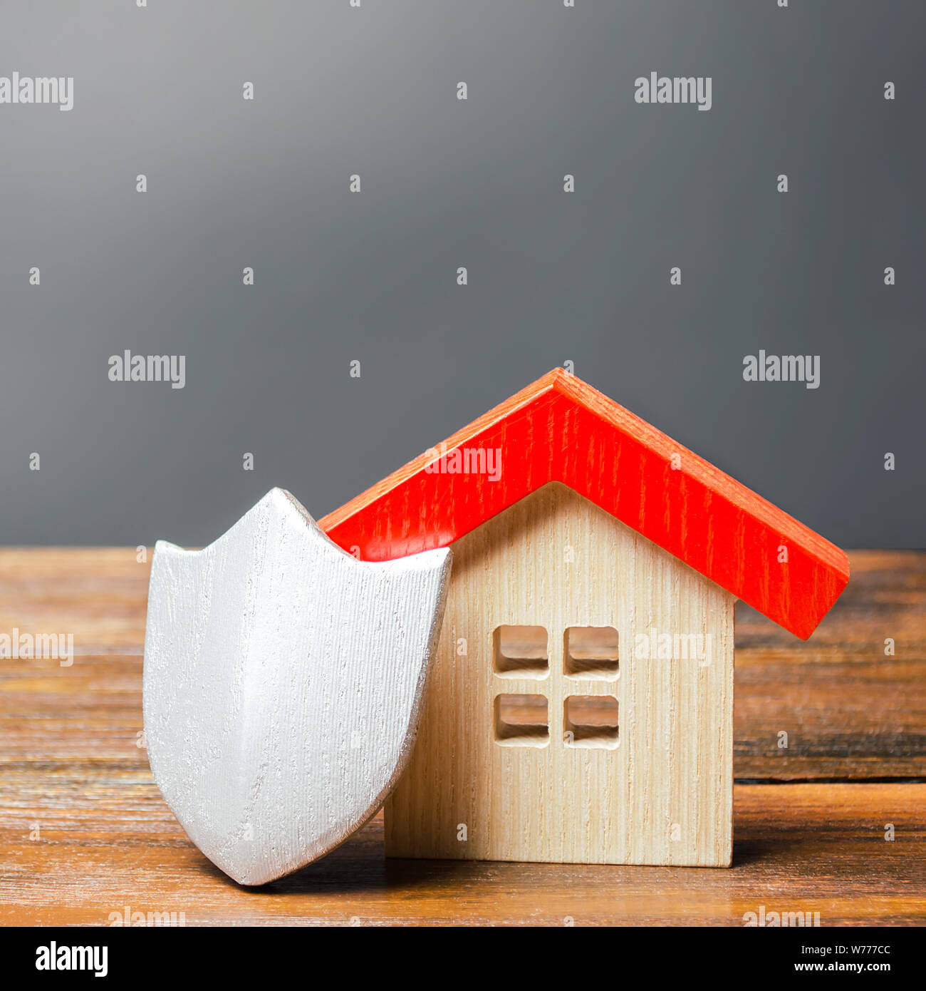House Figurine And Protective Shield The Concept Of Home Security