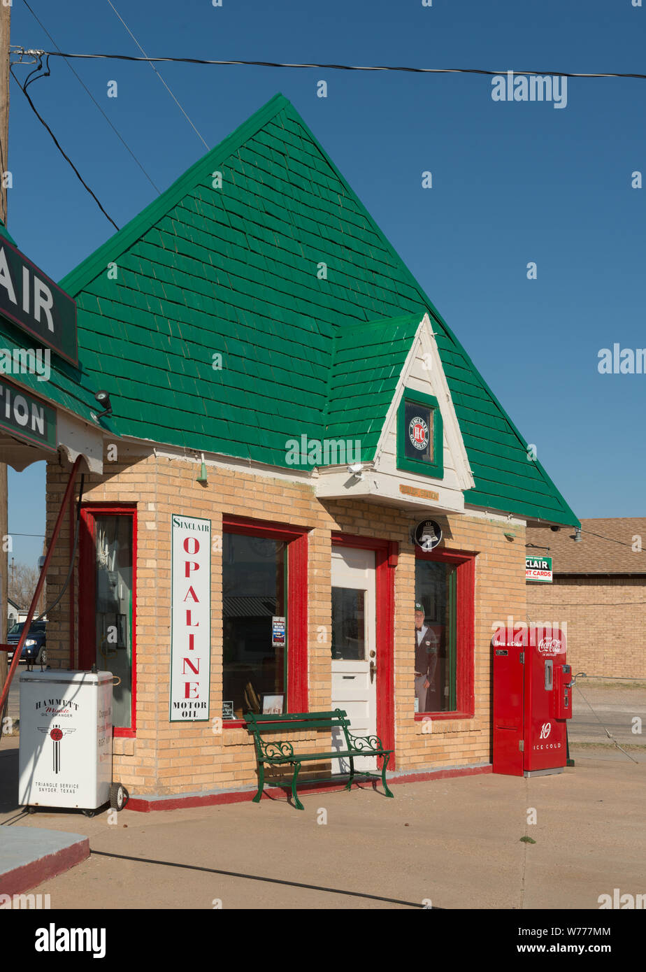 A carefully restored old Sinclair gasoline station in Snyder, the seat of Scurry County, Texas Physical description: 1 photograph : digital, tiff file, color.  Notes: The small, triangular building dates to 1935. Two men, Franklin Bryant and Lynn Fuller, who specialize in restoring gas pumps and vintage soda machines, restored this Texas landmark, which closed about 1970. Out front is a sign noting the price of gas in the station's heydey, 29.9 cents per gallon.; Title, date, and keywords based on information provided by the photographer.; Gift; The Lyda Hill Foundation; 2014; (DLC/PP-2014:054 Stock Photo