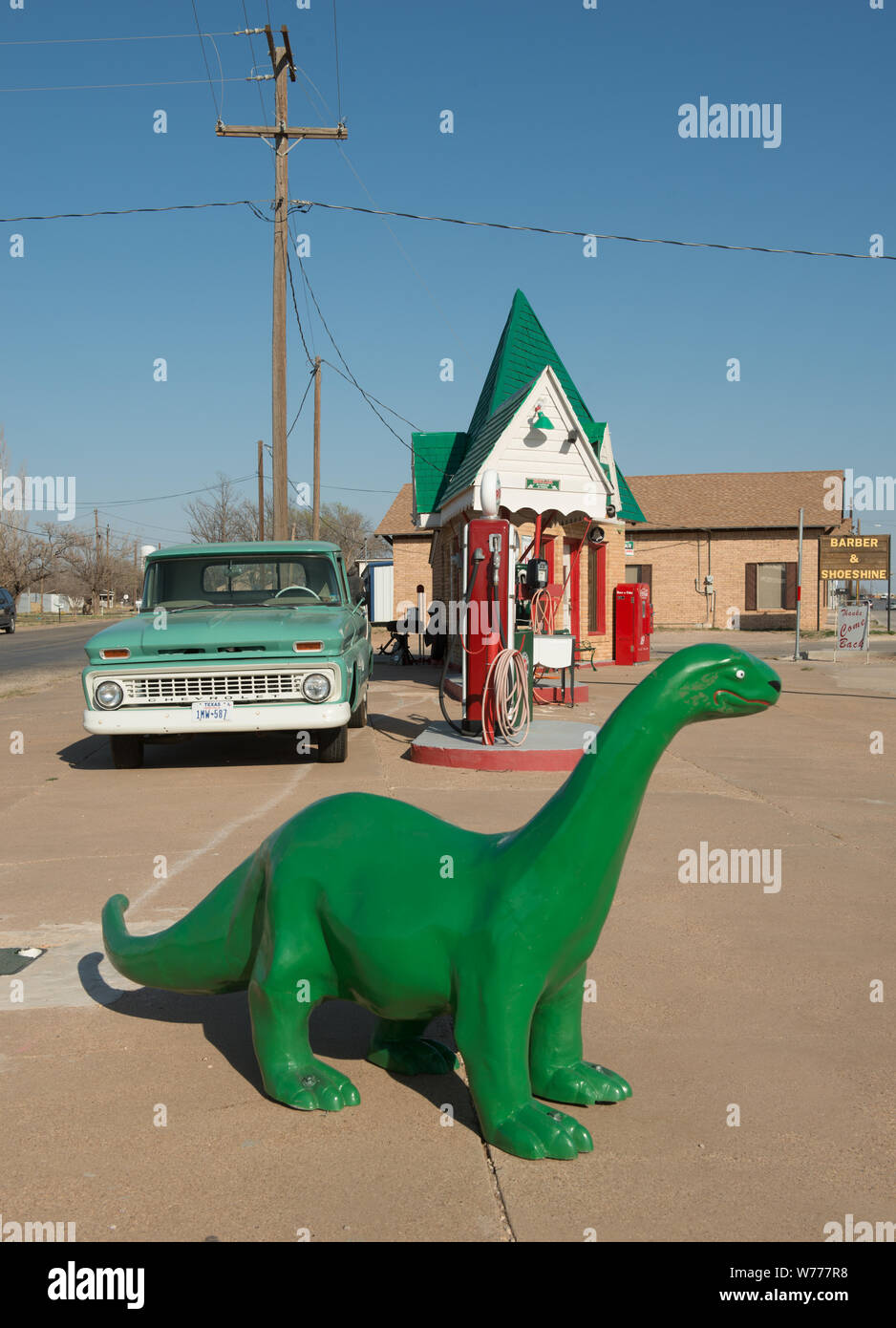 A carefully restored old Sinclair gasoline station, complete with the company's signature dinosaur, in Snyder, the seat of Scurry County, Texas Physical description: 1 photograph : digital, tiff file, color.  Notes: The small, triangular building dates to 1935. Two men, Franklin Bryant and Lynn Fuller, who specialize in restoring gas pumps and vintage soda machines, restored this Texas landmark, which closed about 1970. Out front is a sign noting the price of gas in the station's heydey, 29.9 cents per gallon.; Title, date, and keywords based on information provided by the photographer.; Gift; Stock Photo