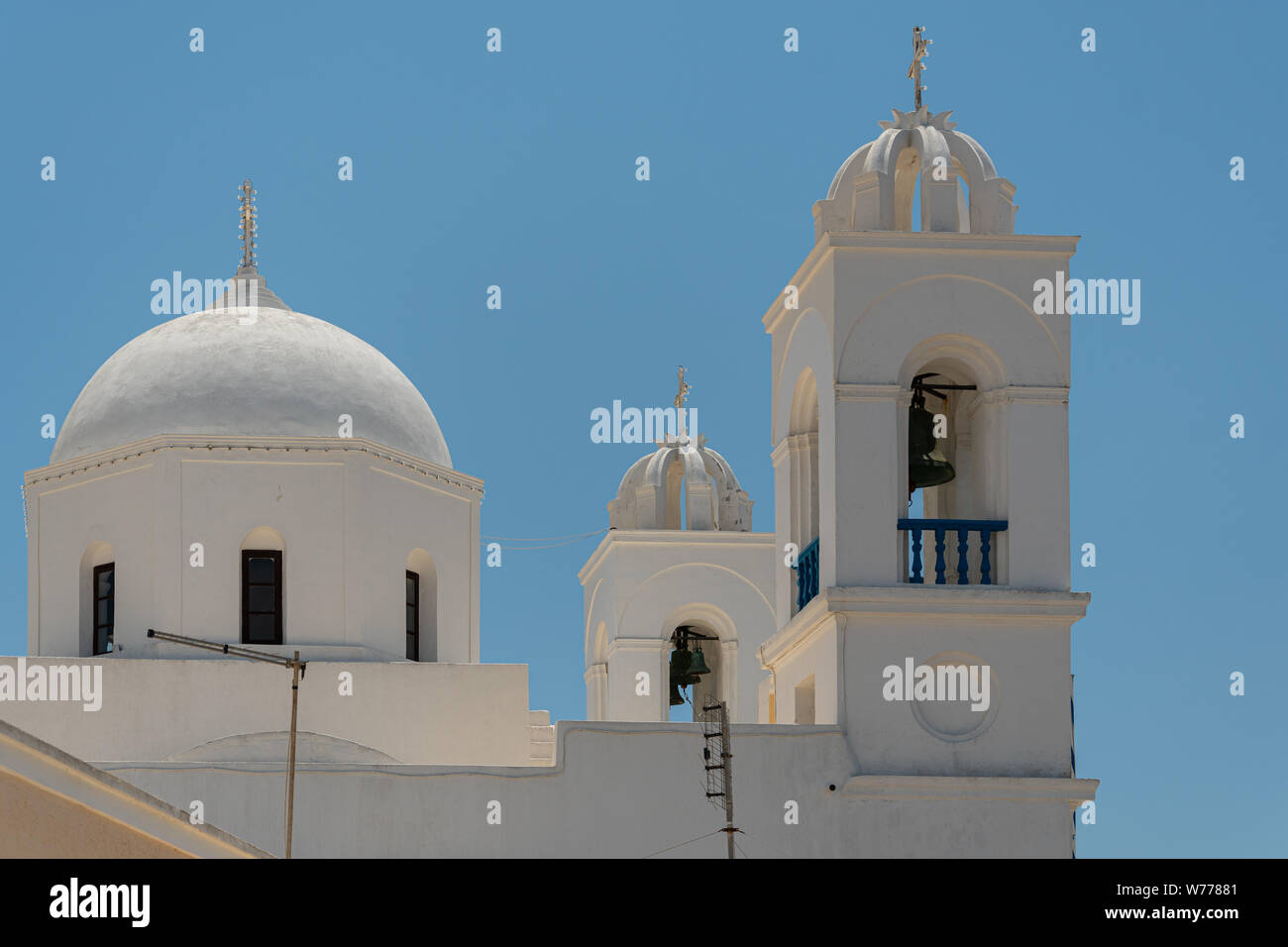 The dome and bell towers of Agii Anargiri church in Megalochori on Santorini Stock Photo