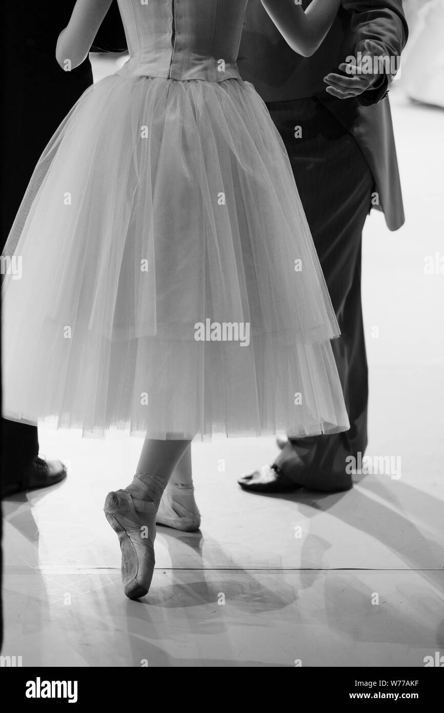Ballerina with a partner at the moment of entering the stage Stock Photo