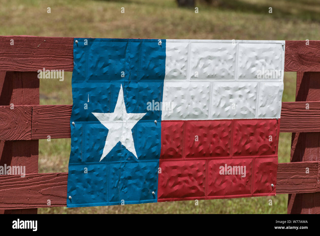 A metal version of the Texas Lone Star state flag, fashioned on a section of ceiling tin, on a ranch fence in Washington County, Texas Physical description: 1 photograph : digital, tiff file, color.  Notes: Title, date, and keywords based on information provided by the photographer.; Gift; The Lyda Hill Foundation; 2014; (DLC/PP-2014:054).; Forms part of: Lyda Hill Texas Collection of Photographs in Carol M. Highsmith's America Project in the Carol M. Highsmith Archive.; Stock Photo