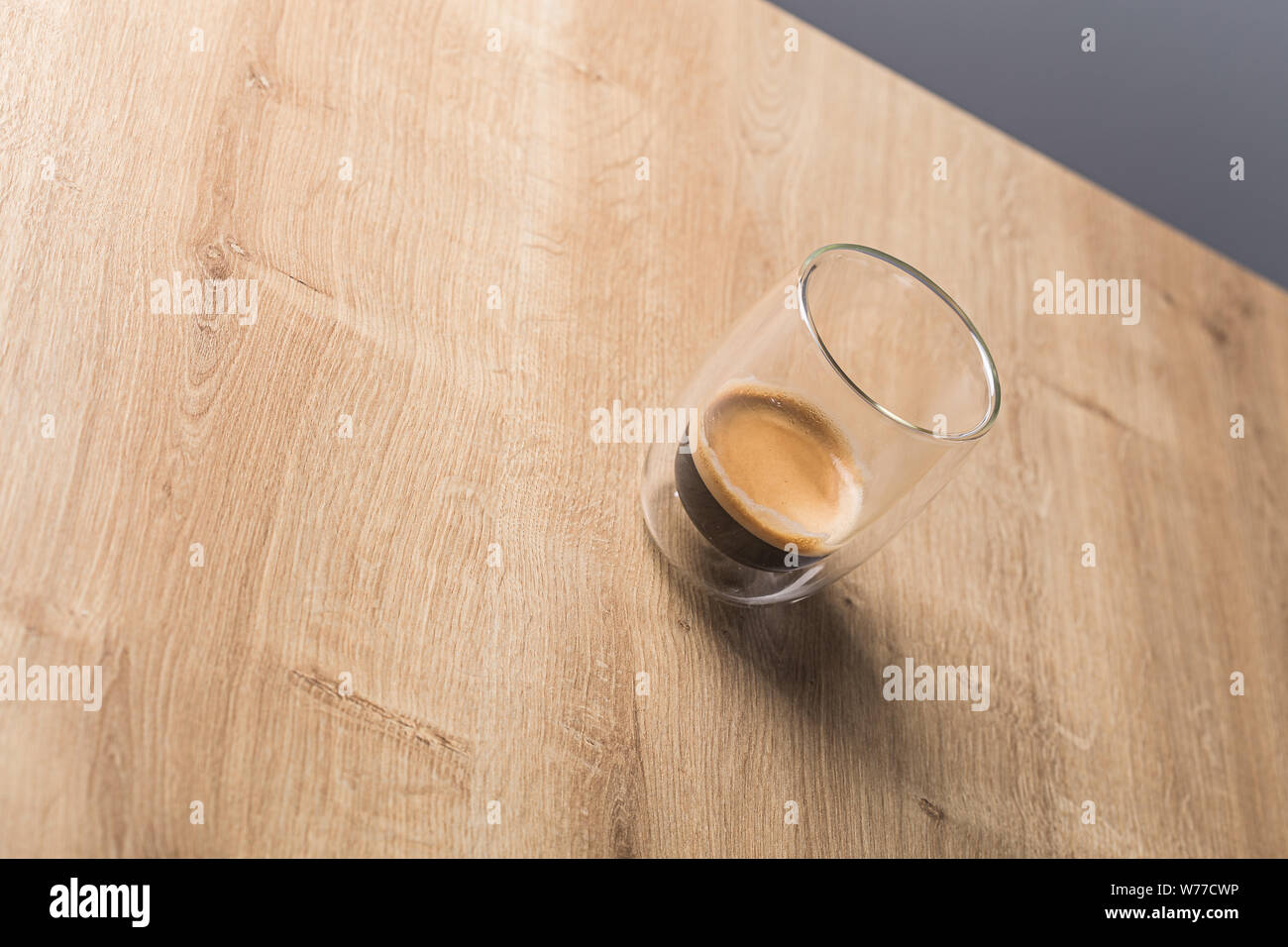 Espresso coffe on a transparent drinking glass on a wooden background Stock Photo