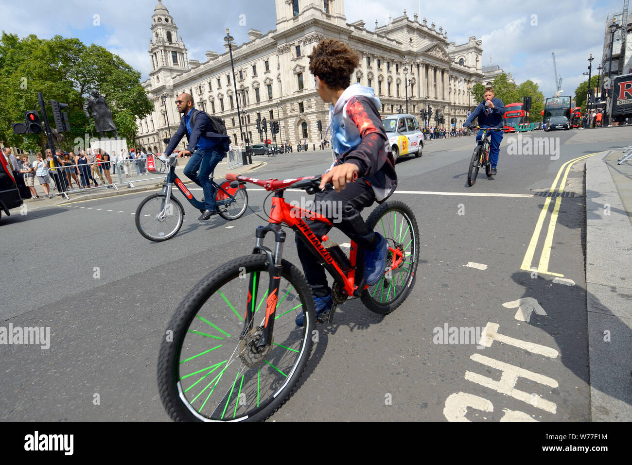 London, England, UK. Boys cycling in Parliament Square Stock Photo