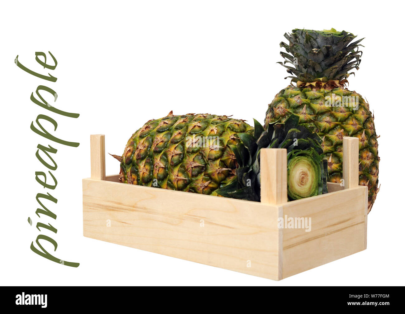 two ripe pineapples in crate isolated on white background Stock Photo