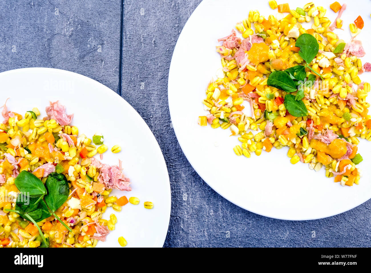 Healthy Ham Hock Summer Salad With Pearl Barley Cereals, Peppers and Piccalilli Dressing Stock Photo