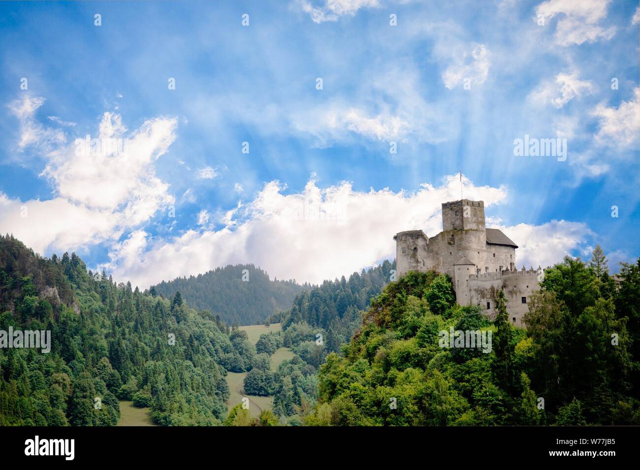 Medieval castle on the green hill and sky with sun rays. Beautiful nature.  Niedzica, Poland Stock Photo - Alamy