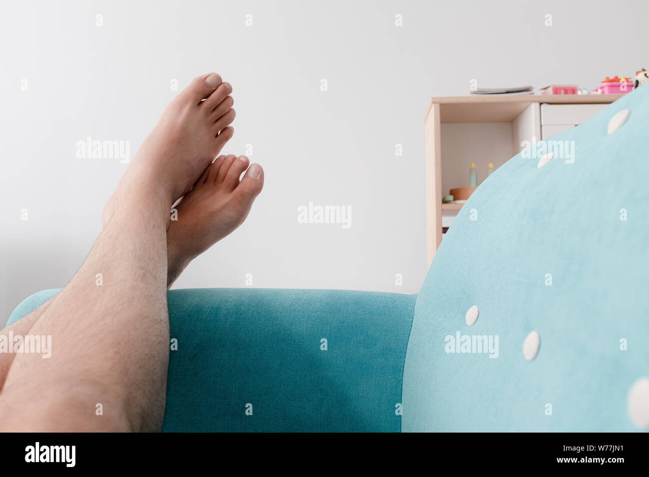 Male feet on sofa hires stock photography and images Alamy
