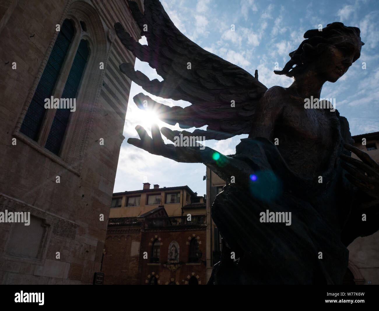 statue of an angel in front of the cathedral of Verona Stock Photo