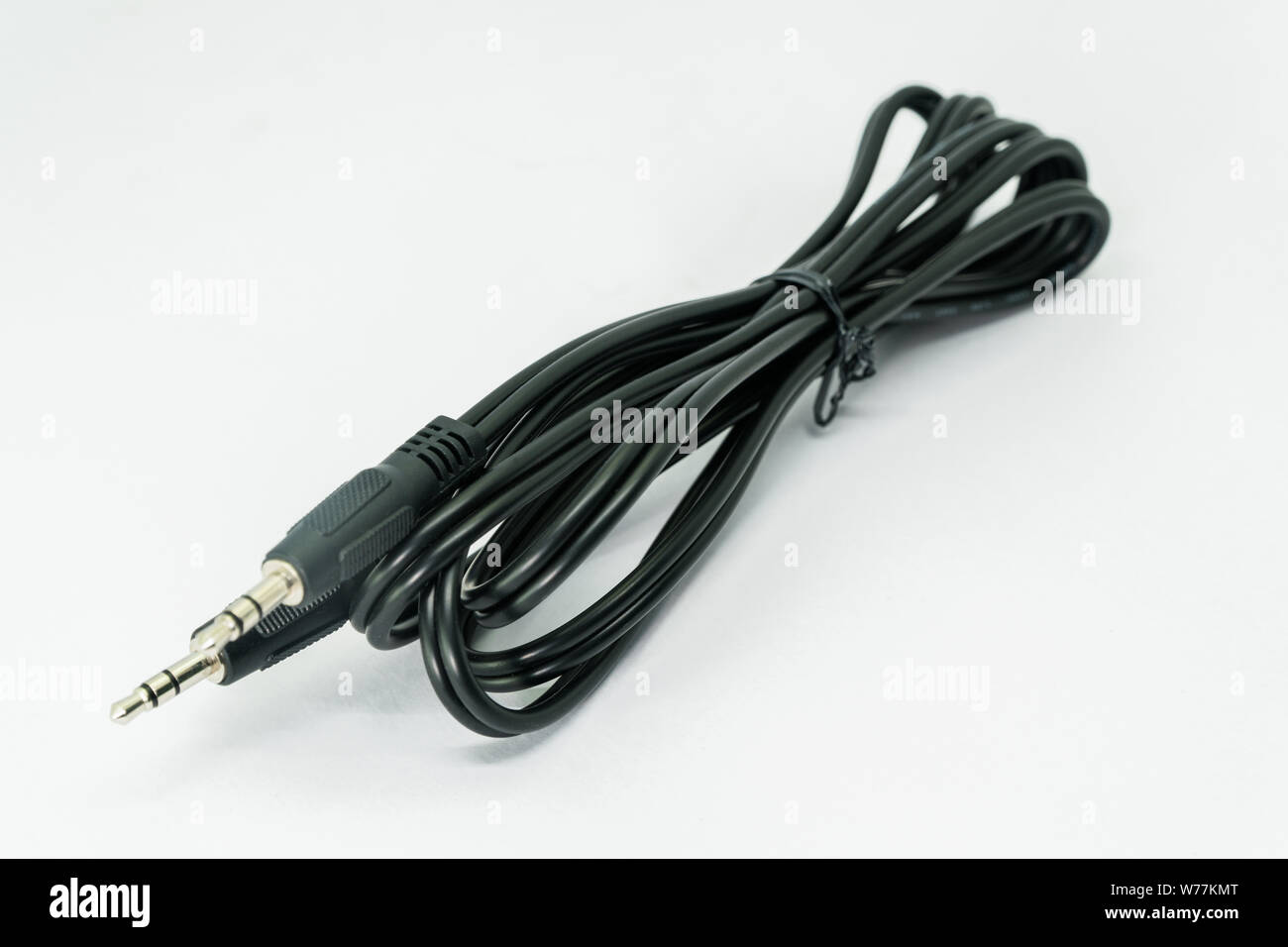 3.5mm jack plug and cable isolated on the white background Stock Photo