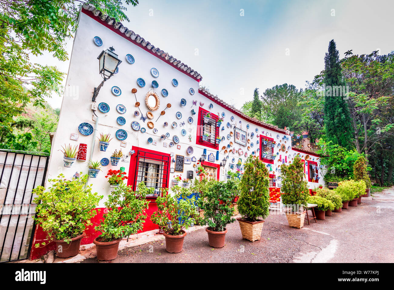 Granada, Spain - May 2016. Casa la Sevillana, flowers decorated gipsy house in Sacromonte, Granada moorish city in Andalusia. Stock Photo