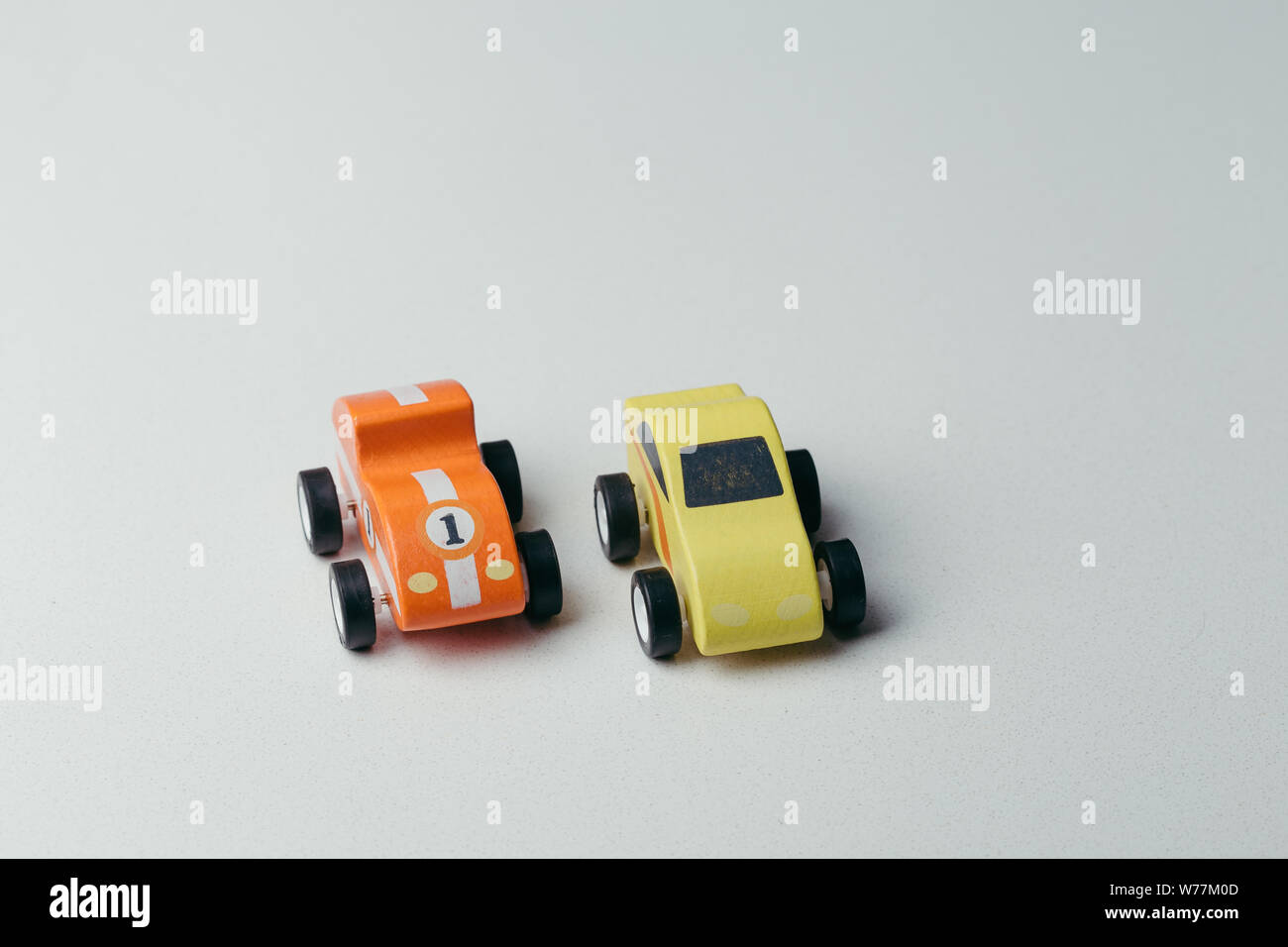 Red and yellow toy car close up on a white background Stock Photo - Alamy