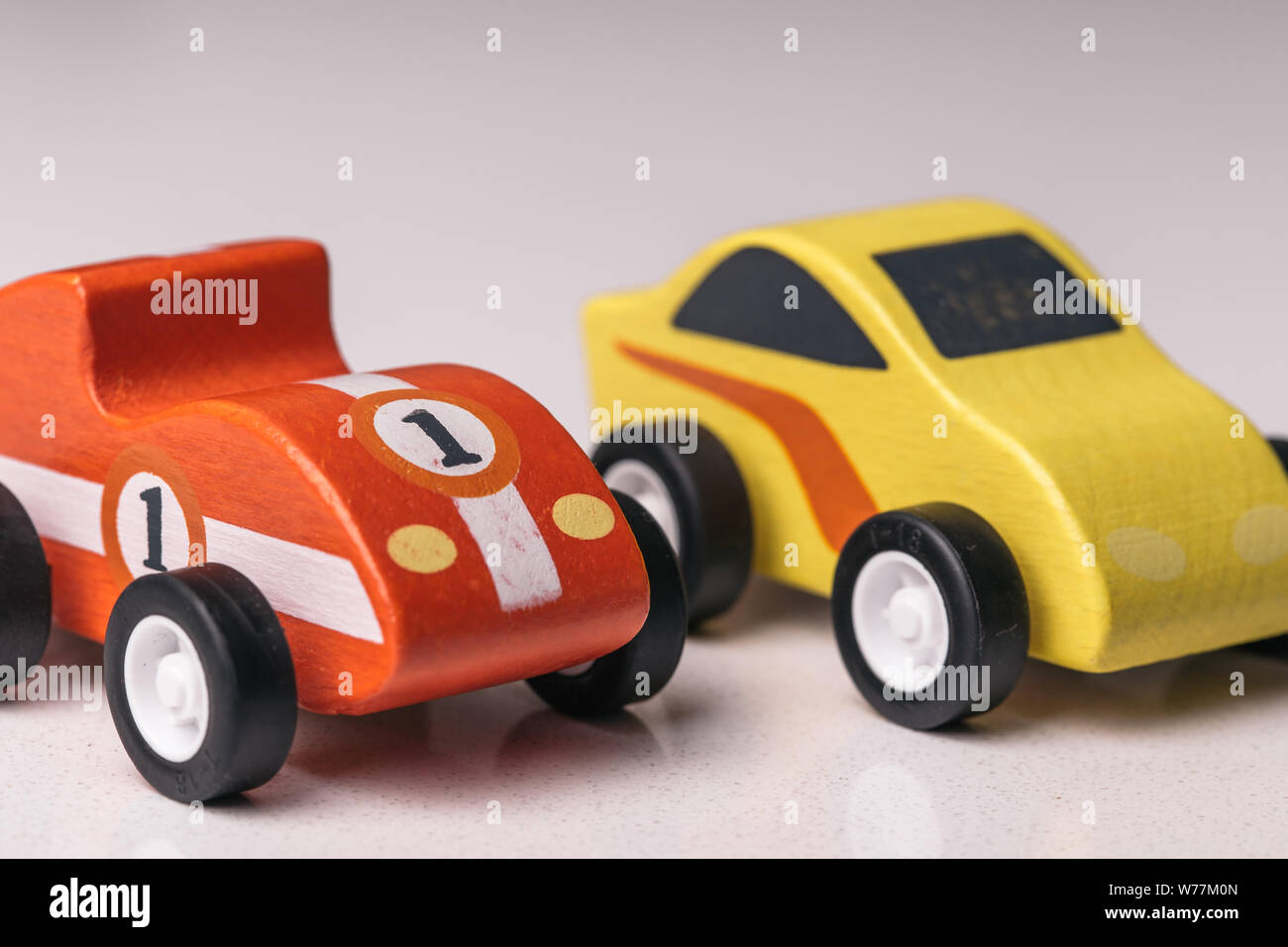Red and yellow toy car close up on a white background Stock Photo - Alamy