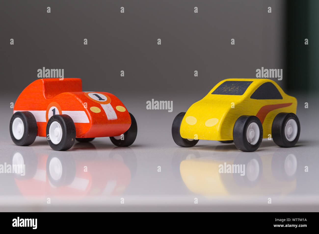 Red and yellow toy car close up on a white background Stock Photo - Alamy