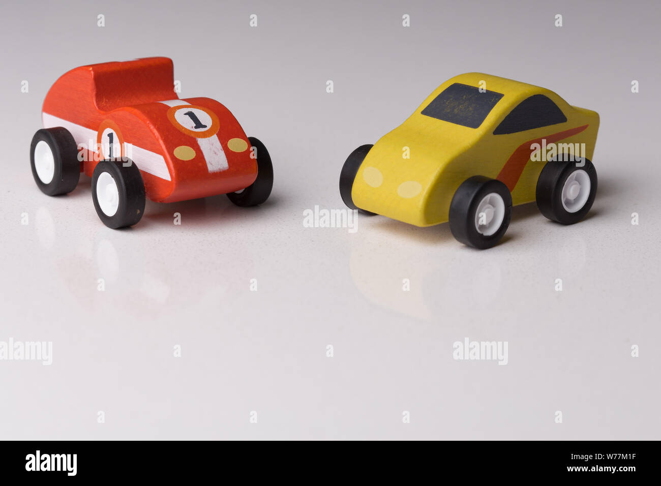 Red and yellow toy car close up on a white background Stock Photo - Alamy