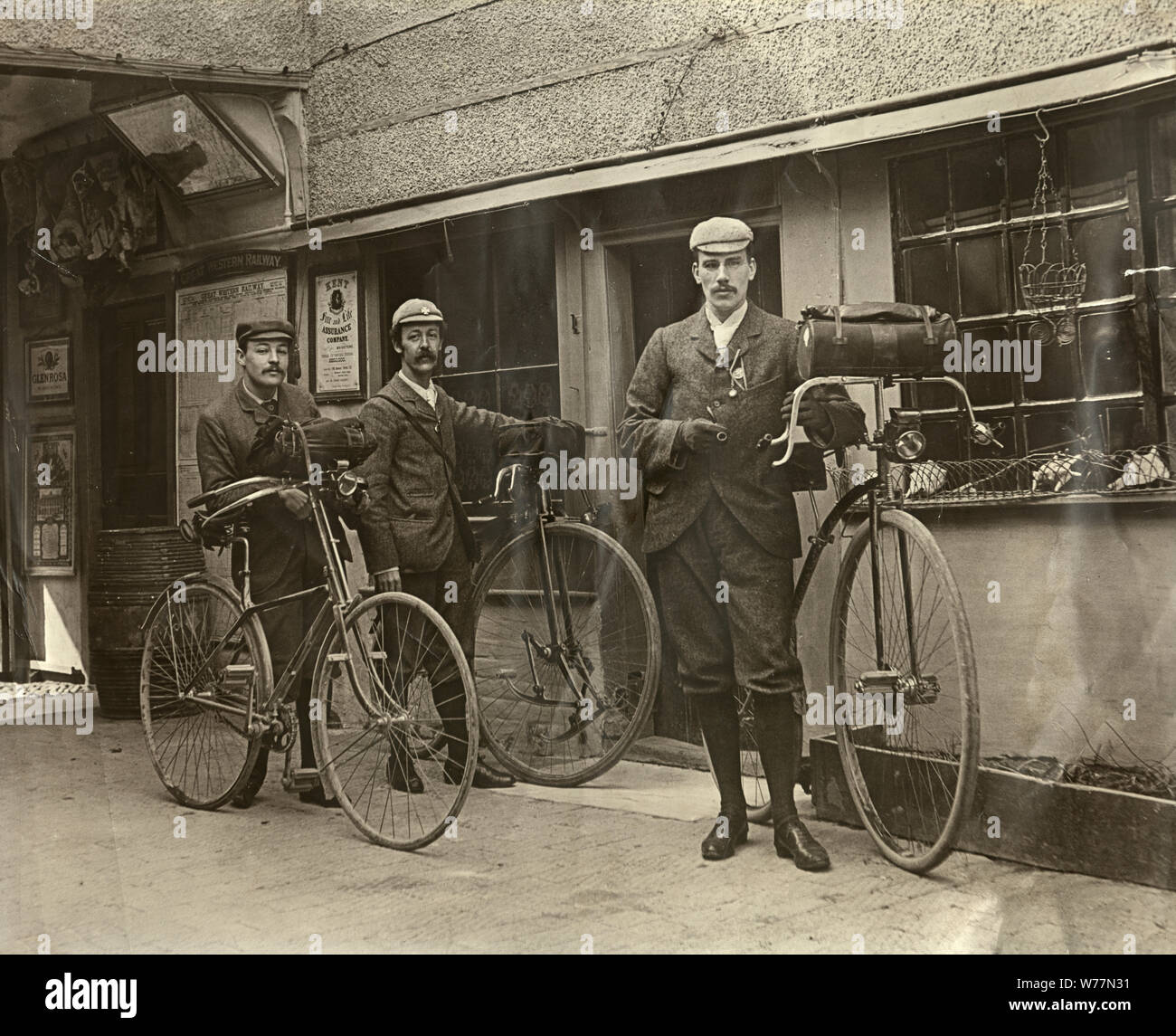 Vintage photograph of Victorian Cyclists outside a Great Western Railway station, with bicycle and penny farthing, 19th Century Stock Photo