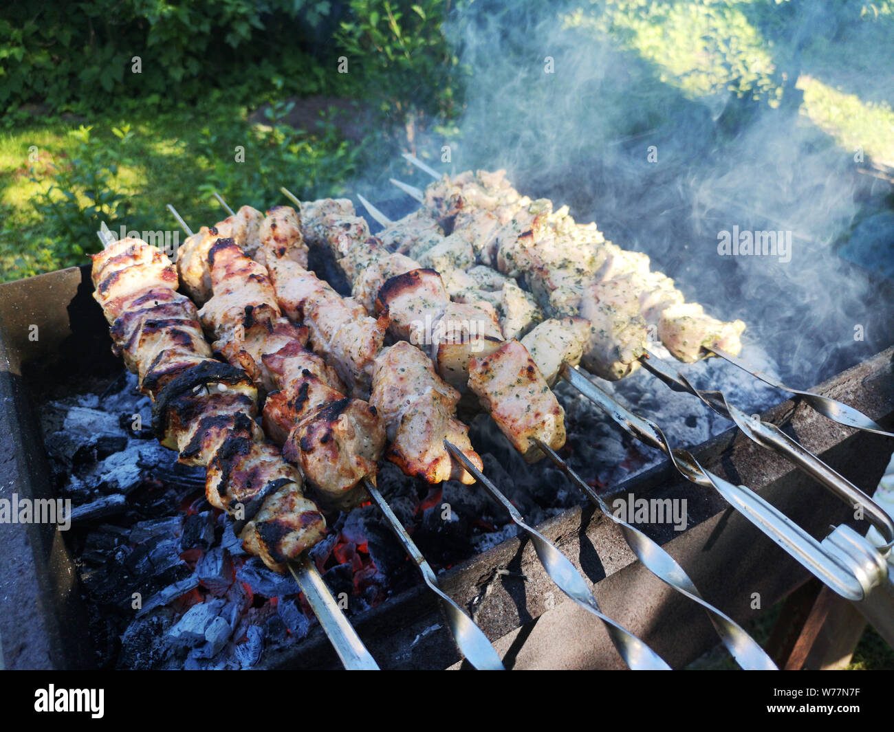 Grilling assorted meat skewers hi-res stock photography and images - Alamy