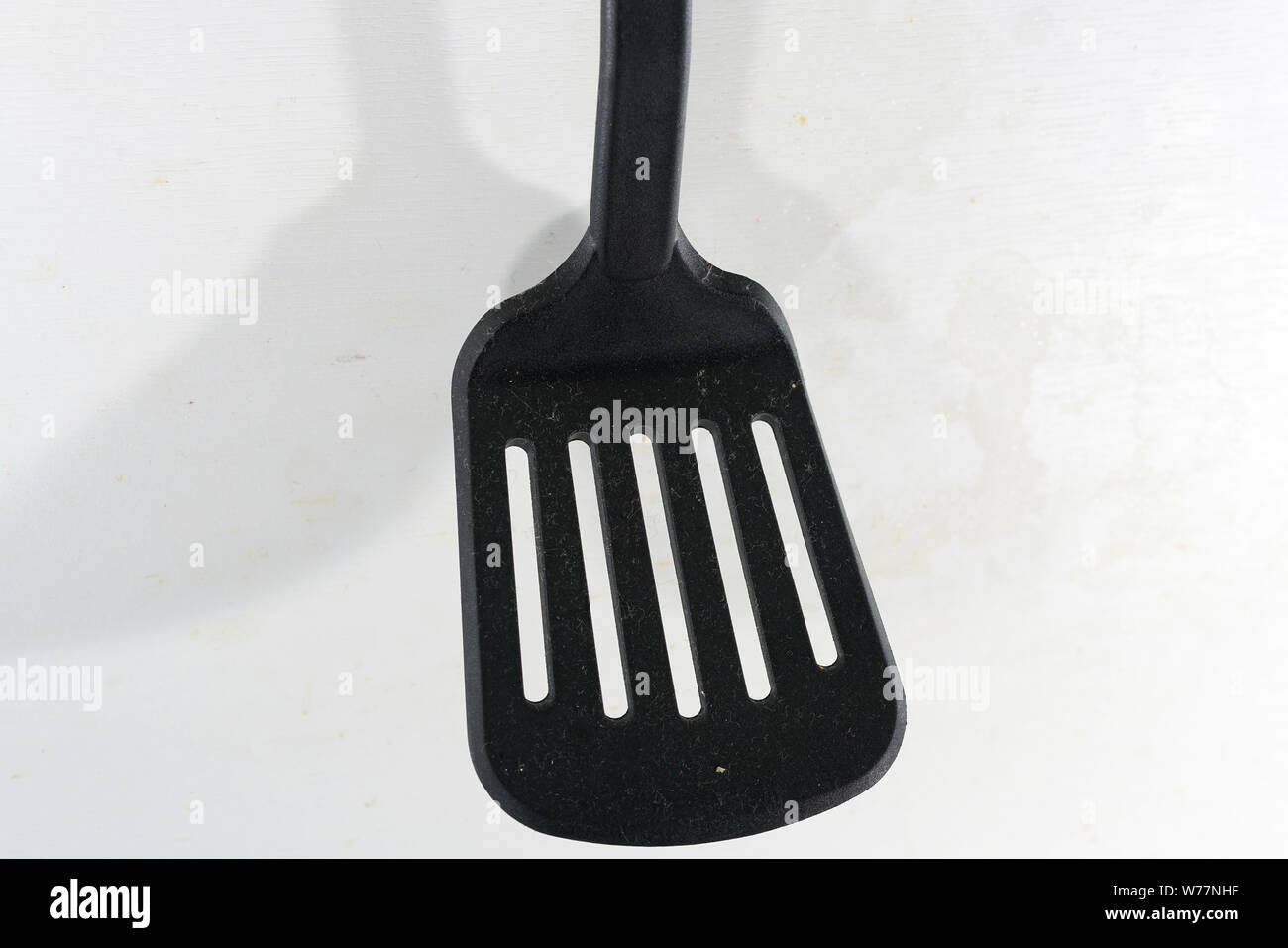 A spatula, also pan knife, slot turner, baking shovel, roasting turner