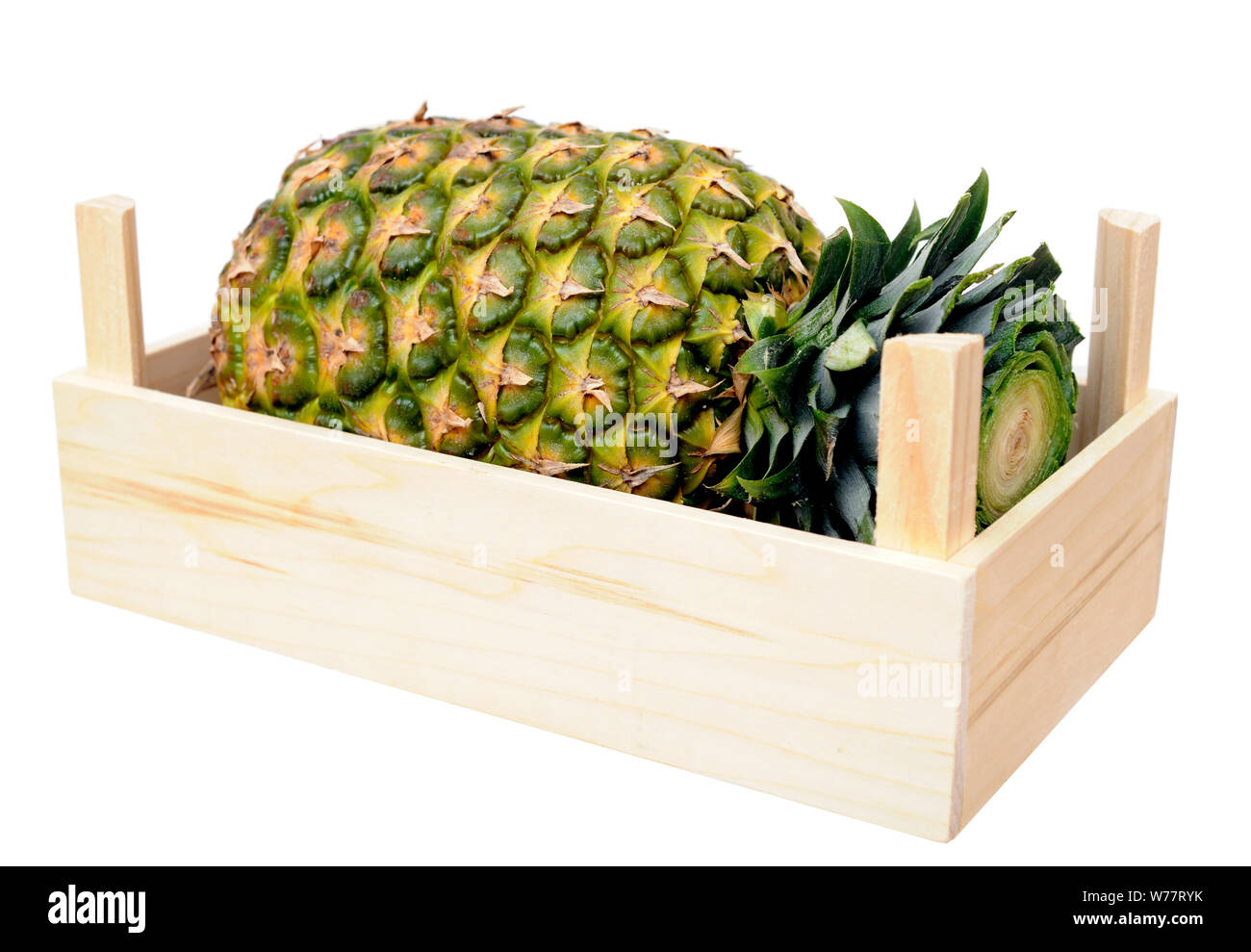 pineapple in crate isolate on white Stock Photo