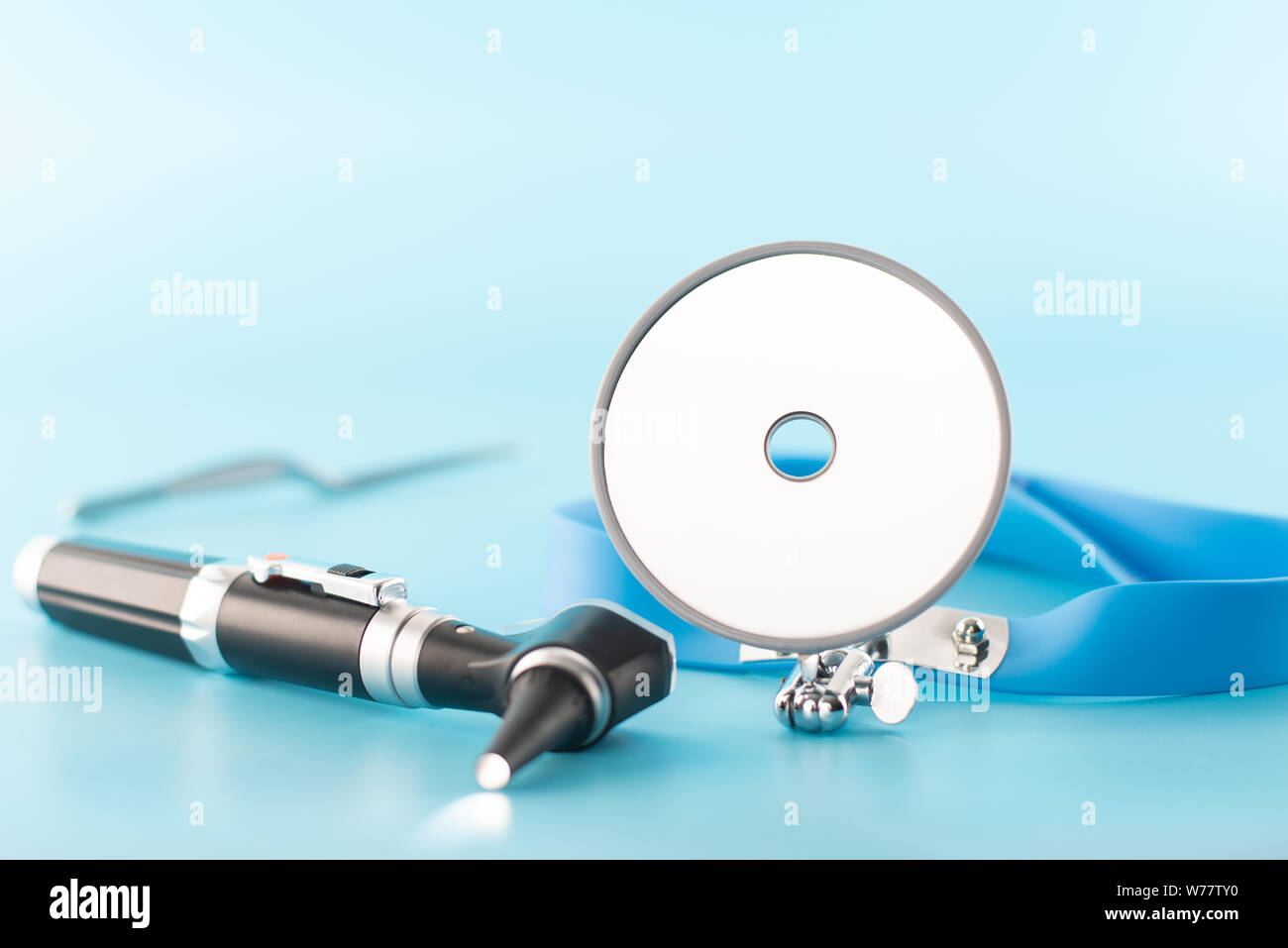 Ear professional instrument on blue background Stock Photo Alamy